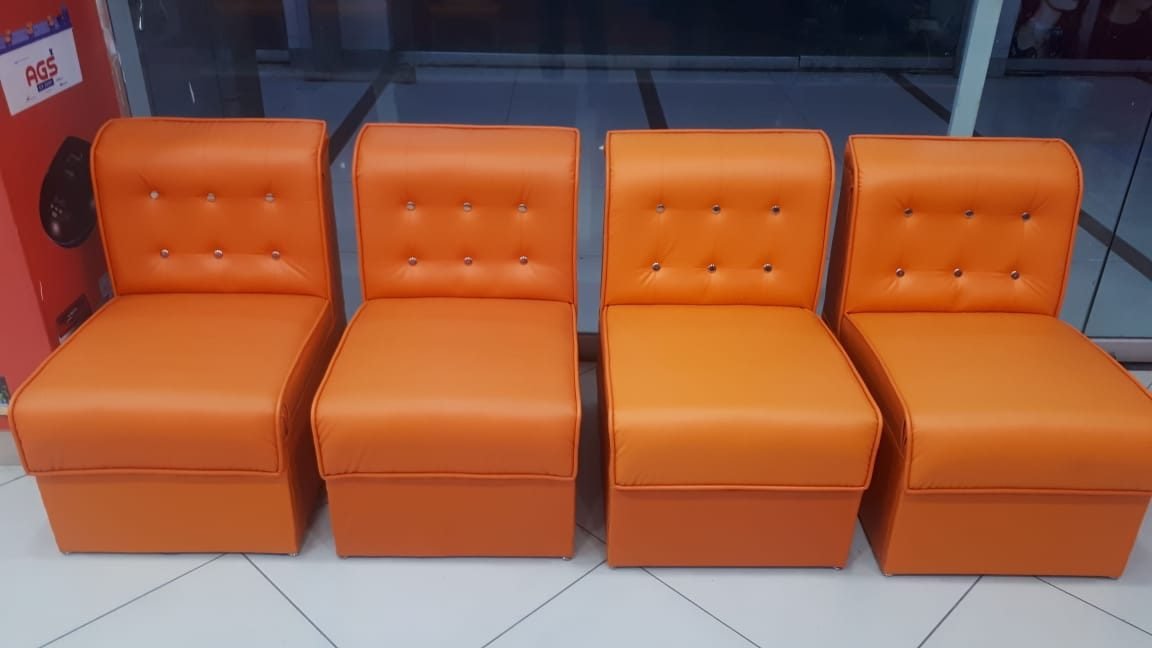 Elegant set of four bright orange upholstered lounge chairs ( per piece )